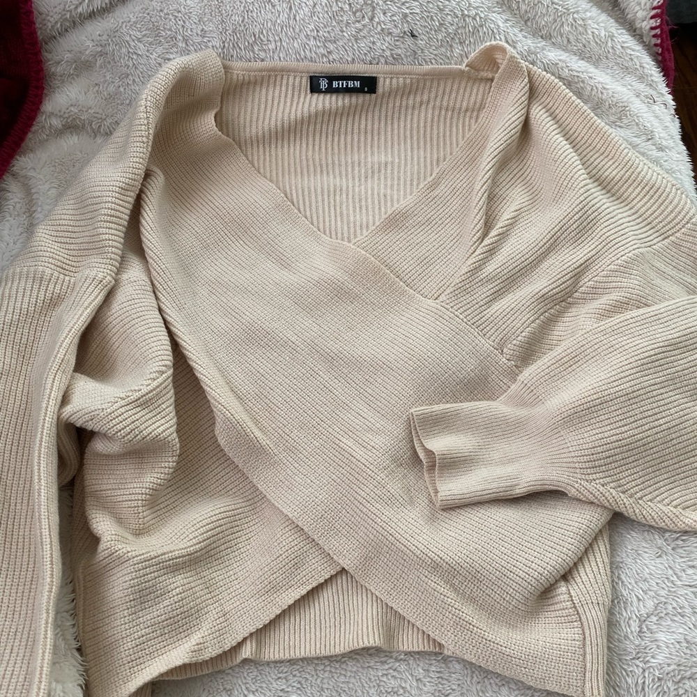 Criss cross cream sweater